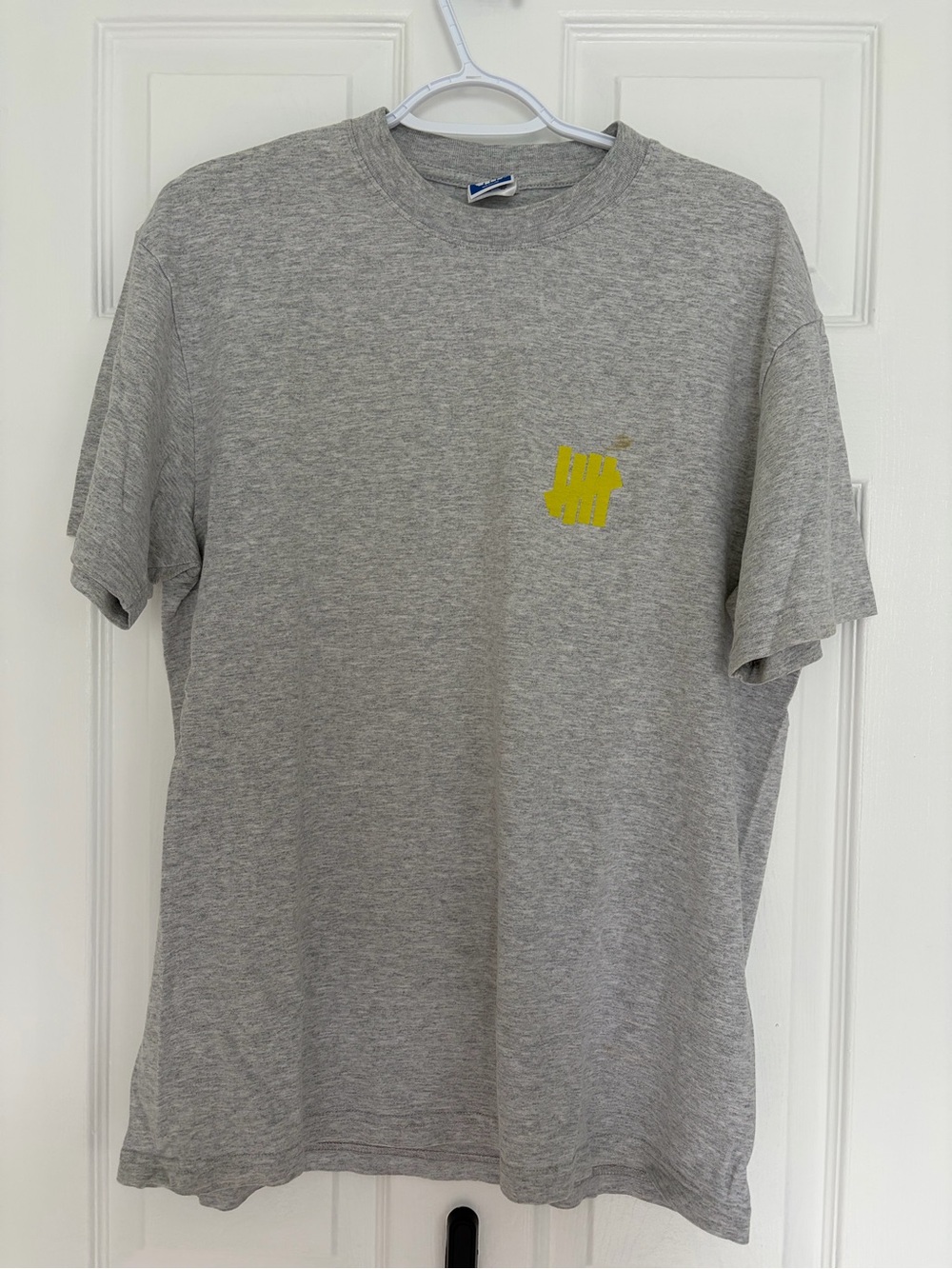 Undefeated Gray Short-Sleeve Crewneck with Yellow Chest Logo
